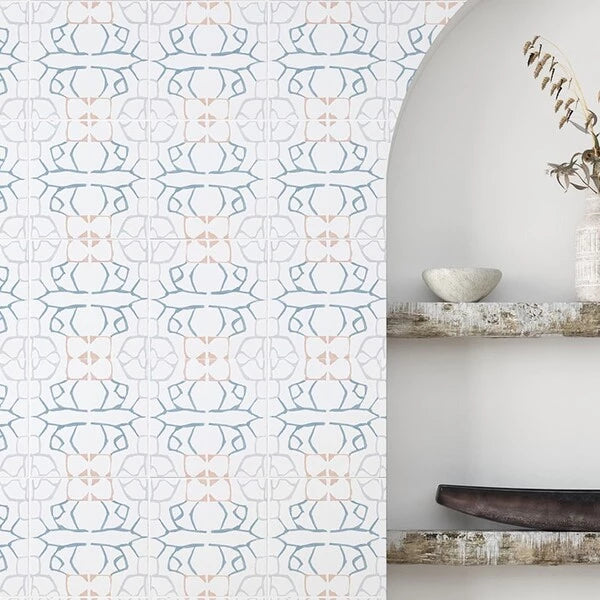 Elegant Zanzibar Ceramic Deco Tile wall showcasing a harmonious pattern of soft blue and peach geometrical designs, adding a contemporary yet classic touch to the interior decor.