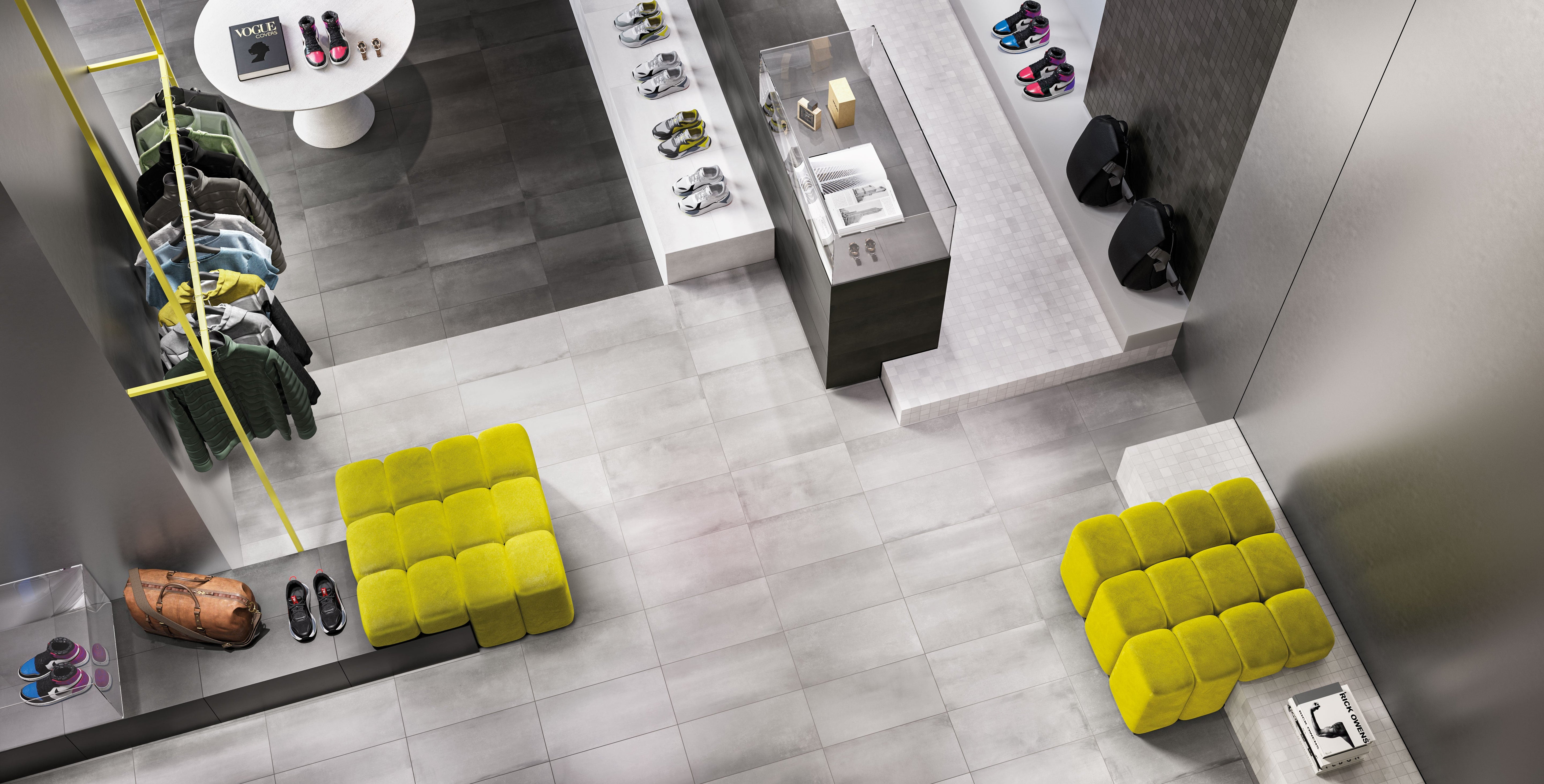 Porcelain tile flooring from Surface Group's Chicago Collection in a modern retail interior setting with neutral tones and vibrant furniture accents.