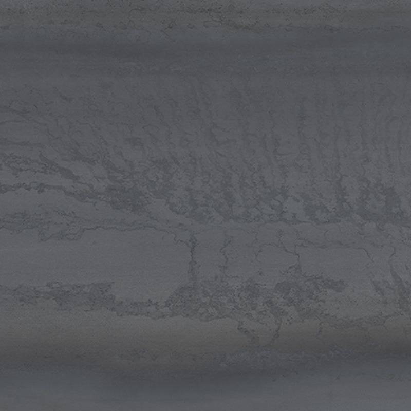 A close-up view of a porcelain tile with a metallic sheen and textured appearance, featuring a combination of deep blue hues intermingled with subtle weathered patterns reminiscent of oxidized metal surfaces.