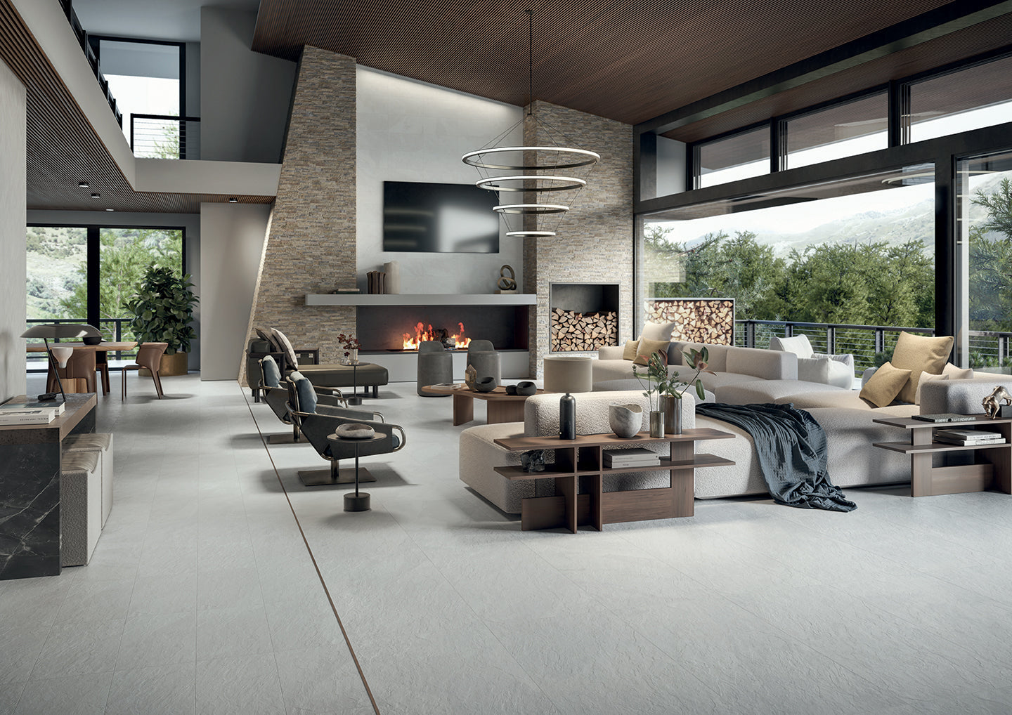 Essence porcelain tile collection in a modern living room setting with fireplace, showcasing various tile patterns and colors by Surface Group.