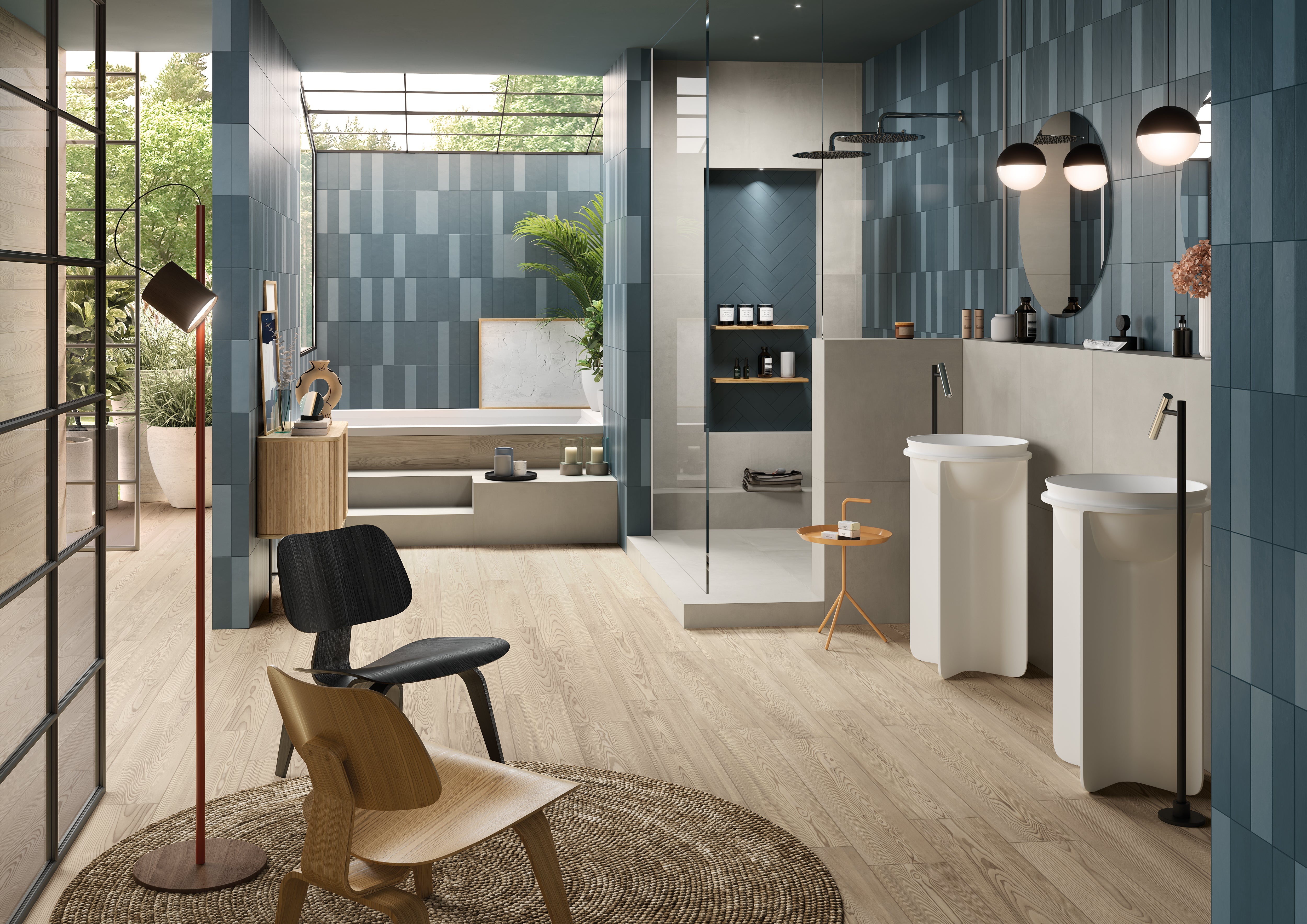 Modern porcelain tile collection from Surface Group showcasing various shades of blue and grey tiles in a stylish bathroom setting with natural light.
