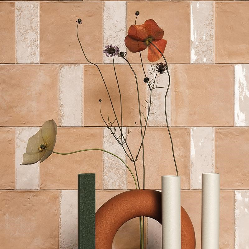 Elegant porcelain tiles with terracotta and clay looks, adorned with delicate wildflowers and artistic ceramic vases in a harmonious interior setup.
