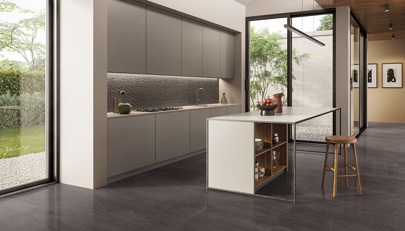 Elegant modern kitchen with Emil Ergon Elegance Pro Italian porcelain tile flooring and backsplash, featuring sleek cabinetry and island with natural light.