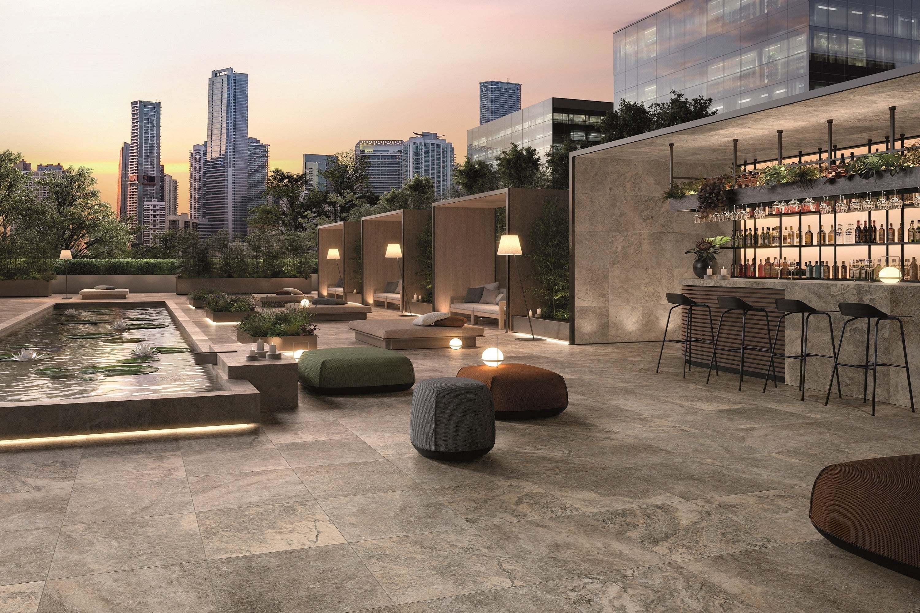 Luxurious travertine porcelain tile collection by Surface Group showcased in an elegant outdoor patio setting with city skyline background.