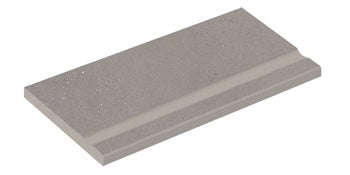 Sleek silver-gray porcelain pool edge with a matte, textured finish, evoking the quiet strength of sedimentary rock and urban minimalism.