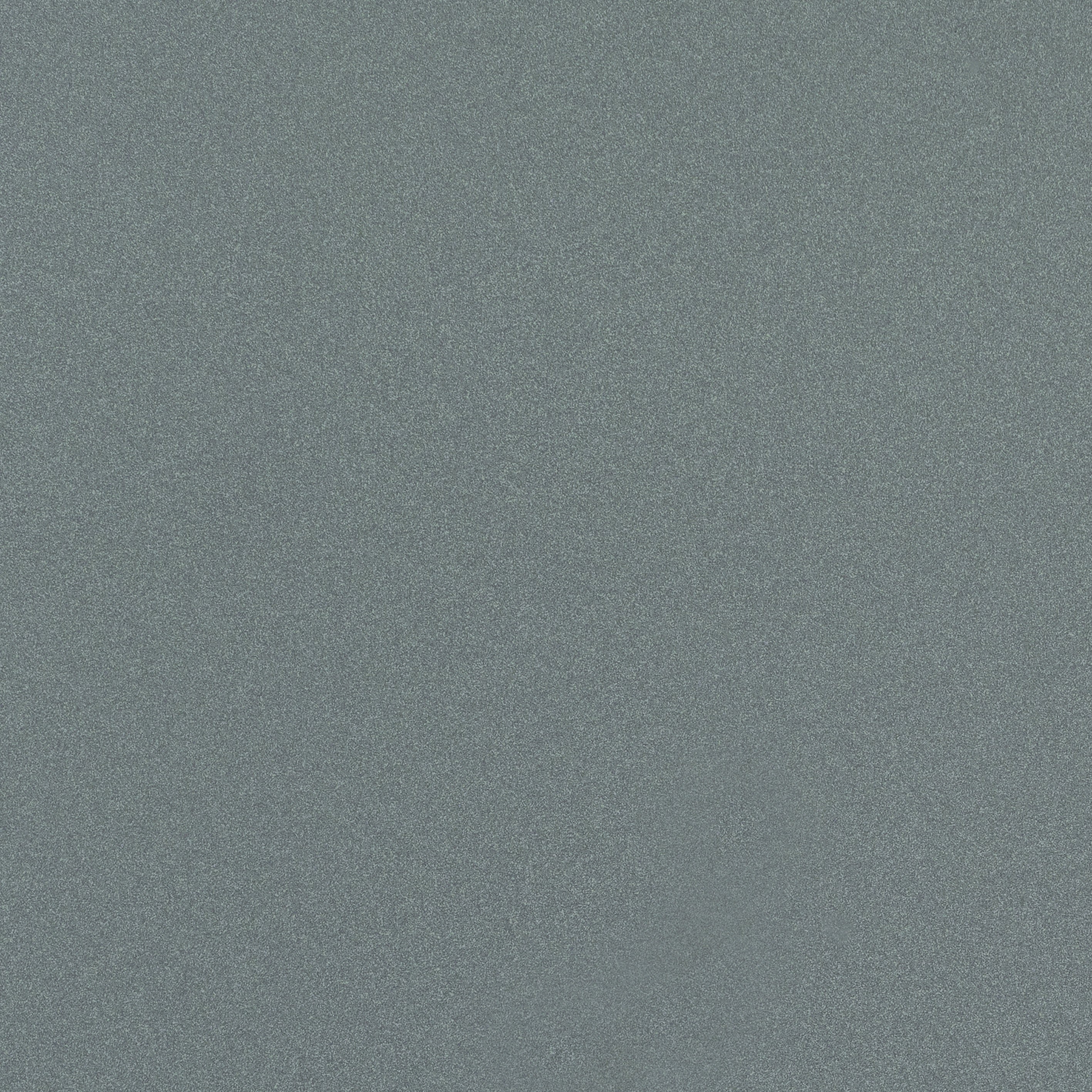 Matte terrazzo-effect porcelain tile in soft gray with fine organic grain, embodying timeless industrial elegance.