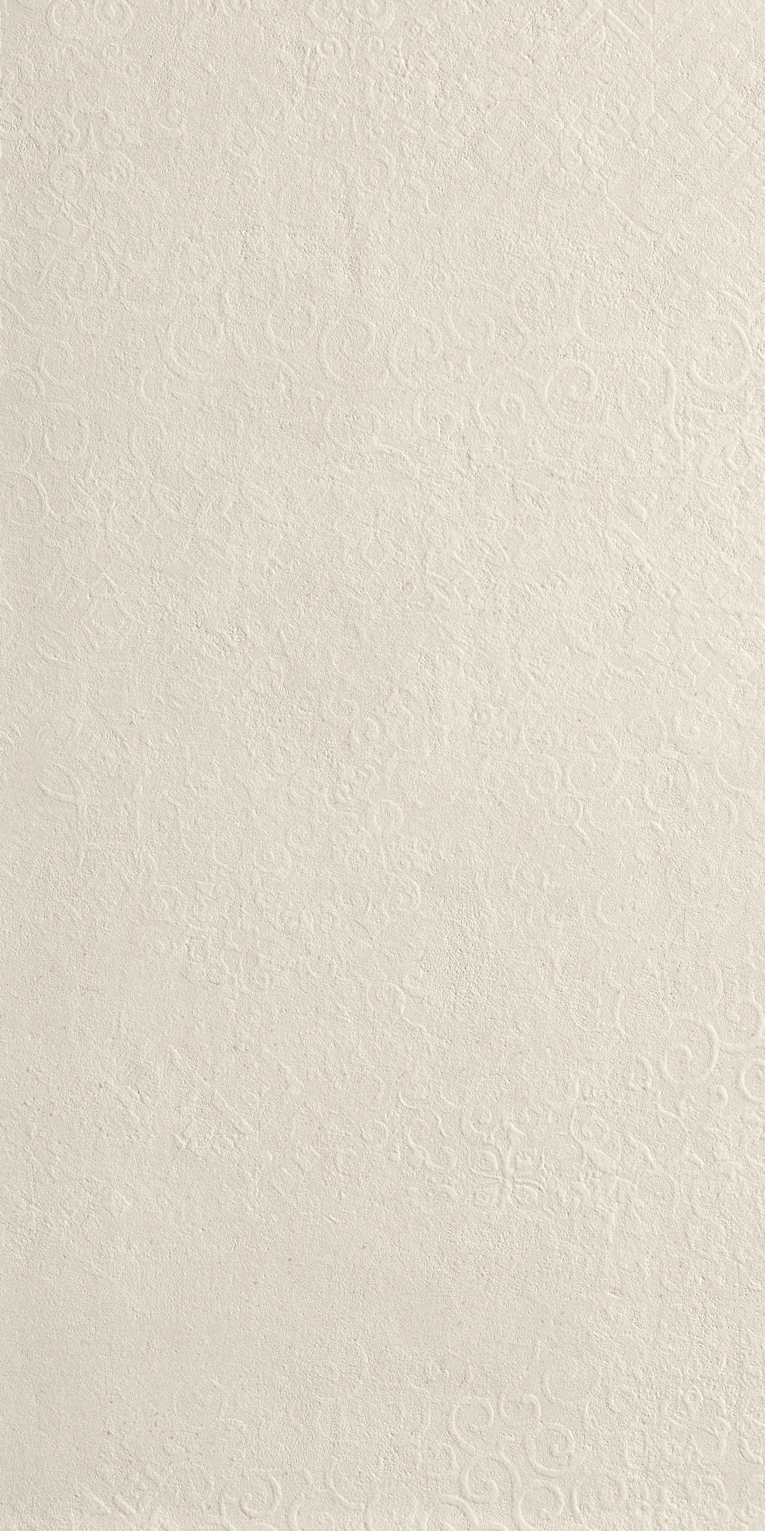 A textured white porcelain tile with delicate deco patterns, luminous reflections, and an elegant matte concrete-inspired finish.