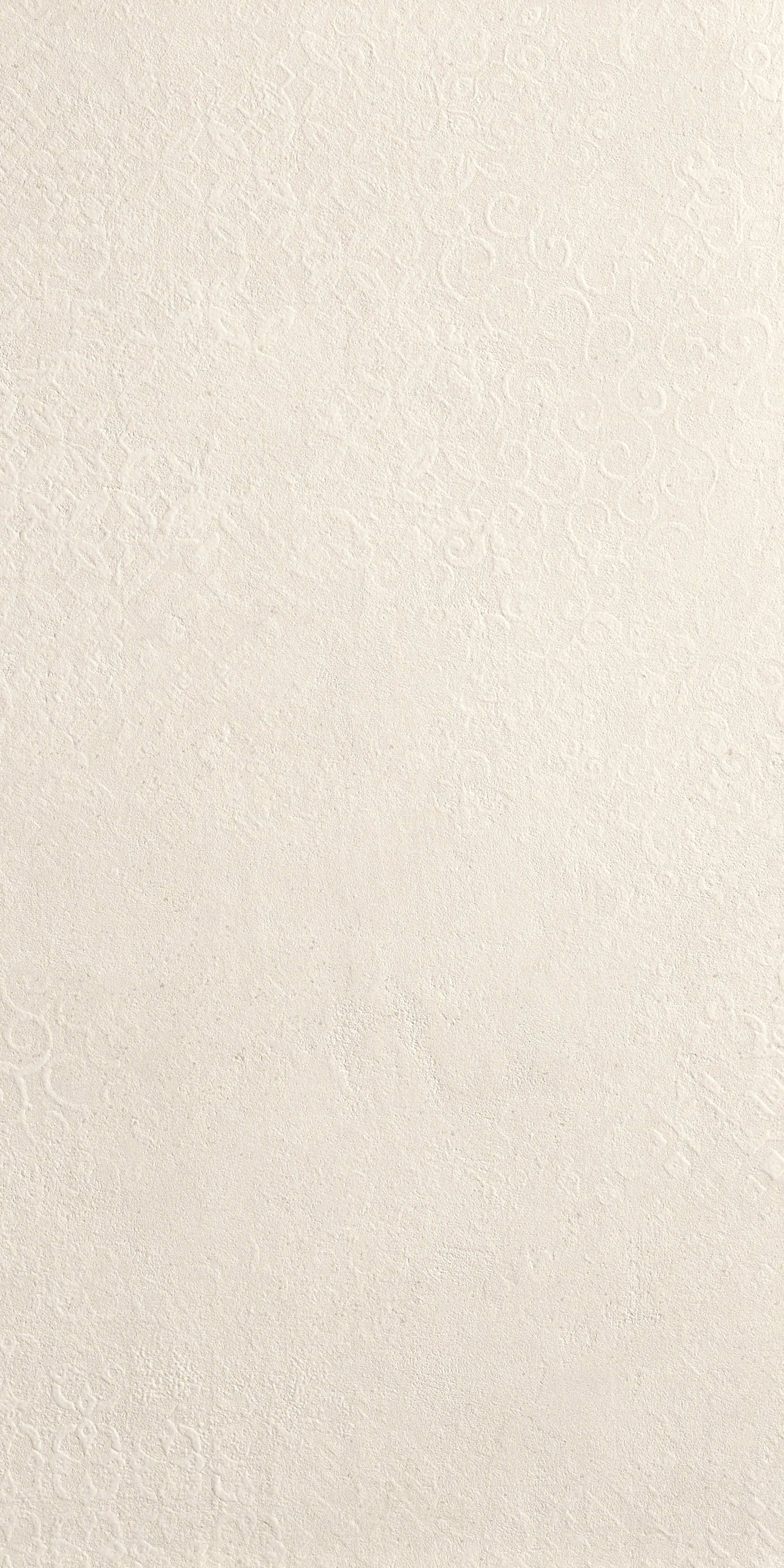 A textured white porcelain tile with delicate deco patterns, luminous reflections, and an elegant matte concrete-inspired finish.
