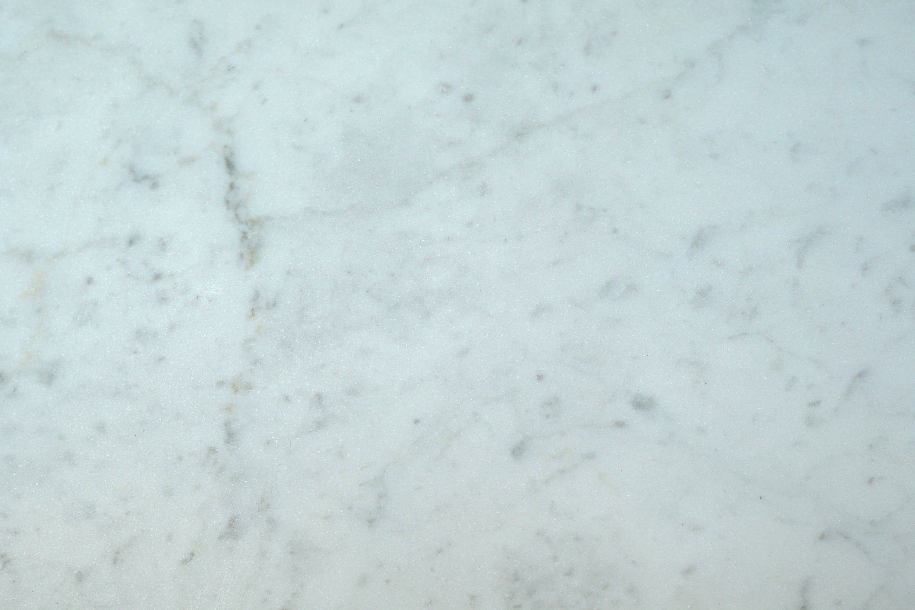 white polished natural marble field tile bianco carrara width of 12 length of 12 and thickness of 0.375 sold to you by surface group international
