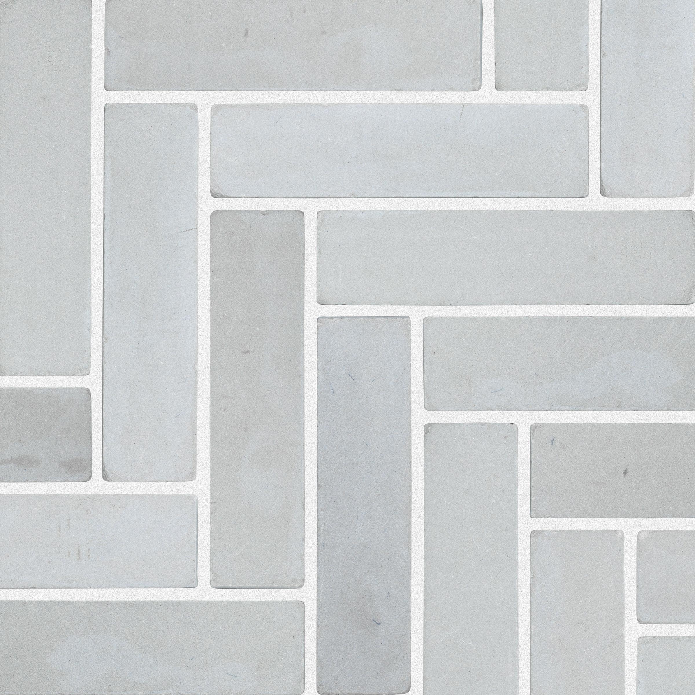 skyline sandstone brick herringbone bush hammered tumbled light grey 2x8x3_8 installed herringbone surface group natural stone resource