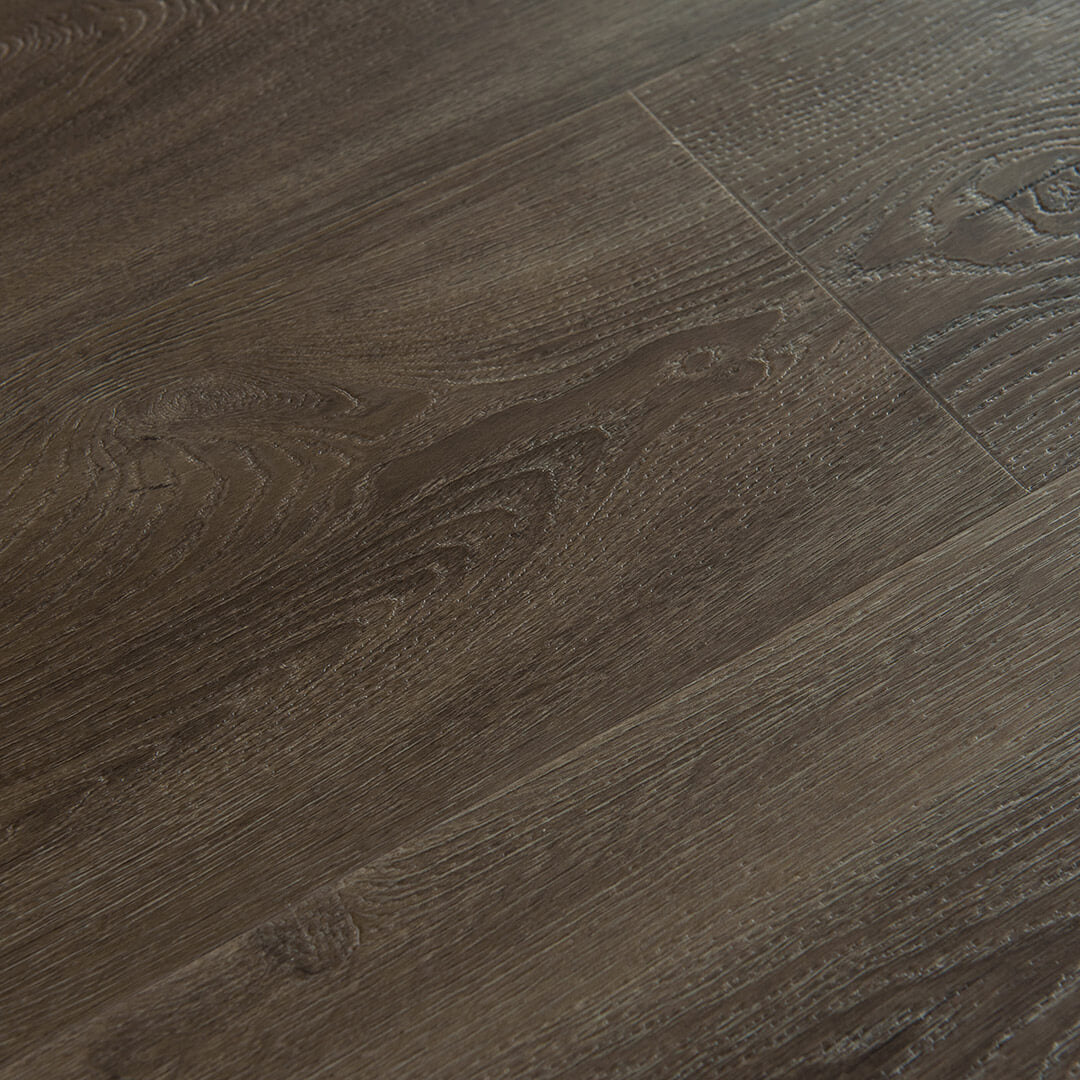 surface group artisan innova smoked wpc vinyl flooring plank angled.jpg