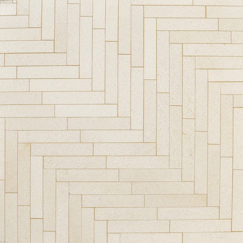 champagne limestone large herringbone rectangle shape natural stone mosaic sheet honed finish 12 and 7 of 8 by 8 and 9 of 16 by  straight edge for interior and exterior applications in shower kitchen bathroom backsplash floor and wall produced by marble systems and distributed by surface group international