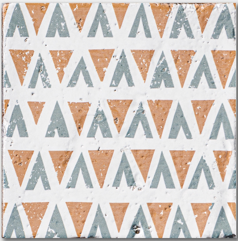 zuni 2 antique glazed terracotta deco tile size six by six sold by surface group manufactured by marble systems used for kitchen backsplashes living room accent walls and bathroom walls