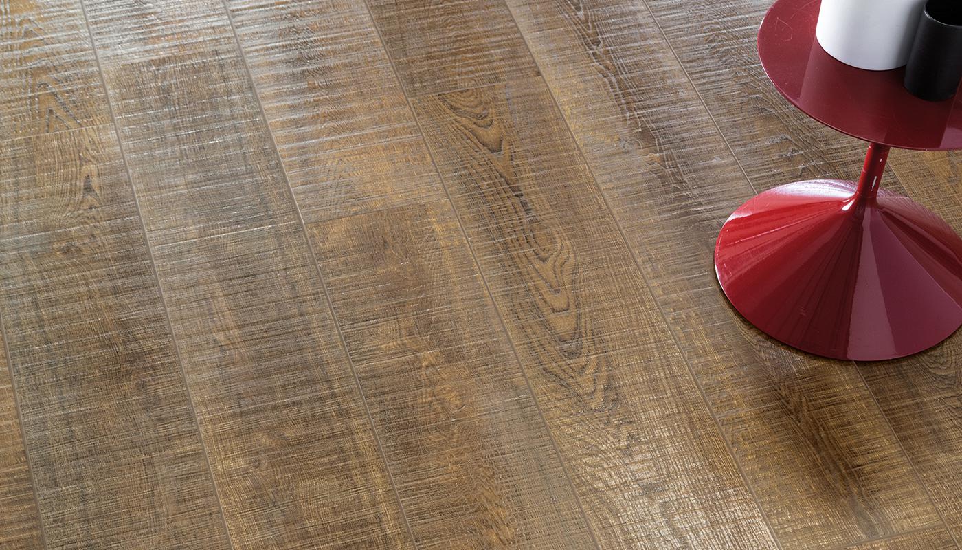 Emil Viva No_Code porcelain tile collection with wood effect finish and modern red table