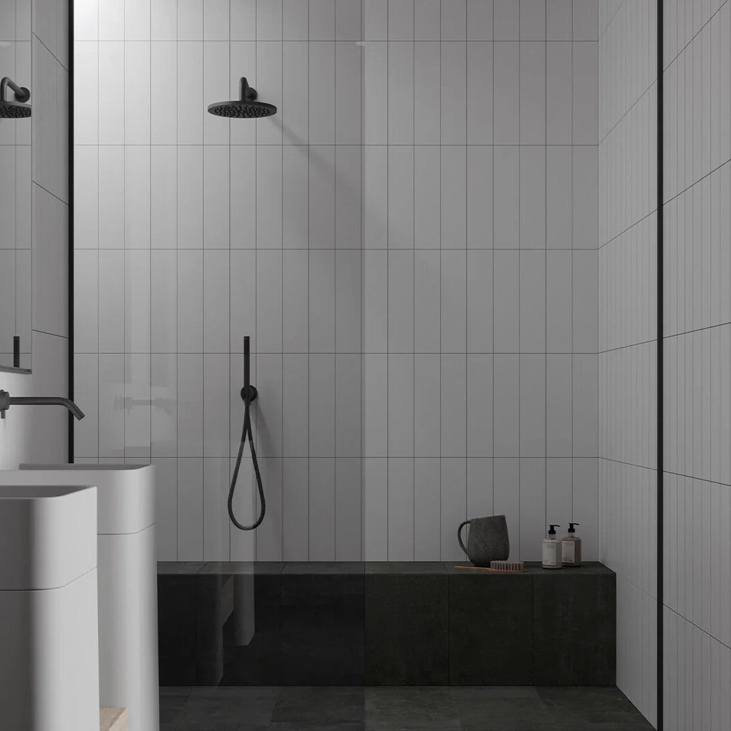 Contemporary bathroom showcasing Anatolia Purity Glazed Ceramic tiles in a sleek, glossy finish, with a monochrome palette creating a modern, sophisticated look.