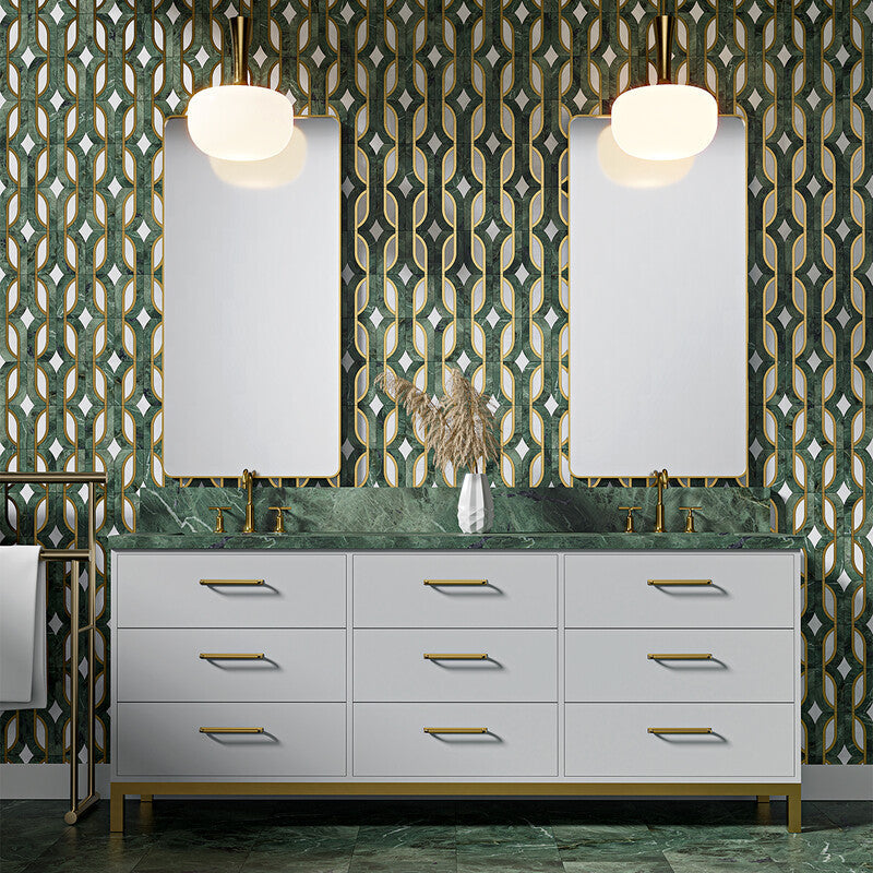 Modern bathroom with green and white geometric tile backsplash, double vanity, gold accents, green marble countertop, and matching floor tiles.