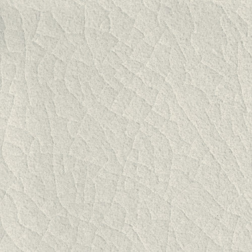 Subtle ash gray ceramic tile texture showing light crackling and color variations suitable for modern interior design