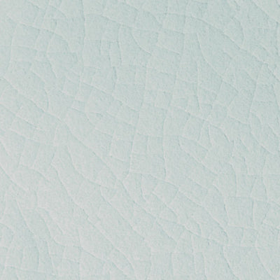 Light blue ceramic tile with a subtle crackled texture, from the ADEX Earth Morning Sky collection, suitable for elegant wall and flooring design.