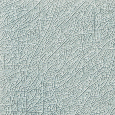Light blue crackled texture ceramic tile from the Ocean Top Sail collection, showcasing subtle variations in hue and a unique glossy surface for elegant interior design.