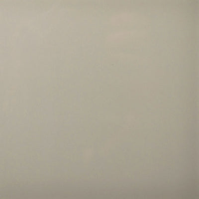 Subtle graystone ceramic tile with smooth texture and slight color variation for modern flooring and wall design.