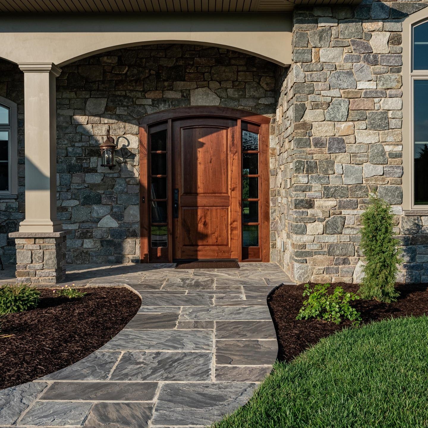 Artisan Series Flagstone Collection, showcasing natural cleft tops and hand-cut rockfaced edges for a traditional and rustic appeal in outdoor or indoor spaces.