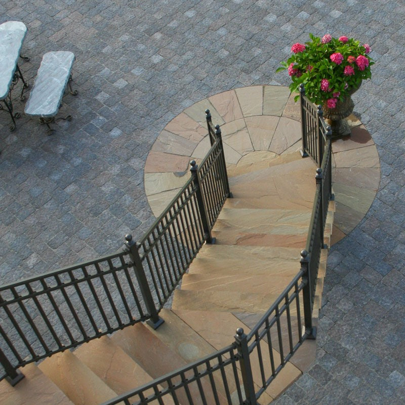Artisan Paving Collection offering a rich assortment of flagstones and caps in natural tones, perfect for crafting elegant, durable outdoor and indoor living spaces.