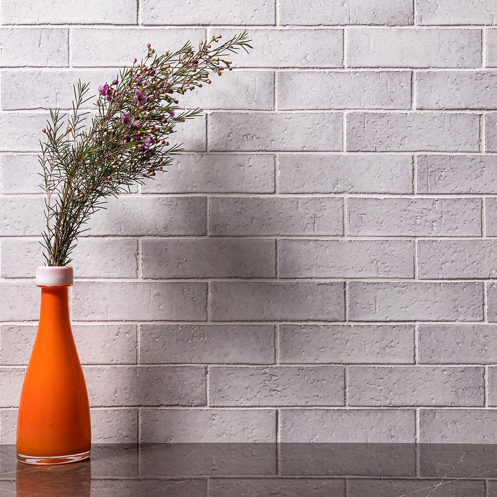 An array of glazed brick veneers in a spectrum of colors, showcasing the harmonious blend of traditional brick texture with a modern, glossy finish.