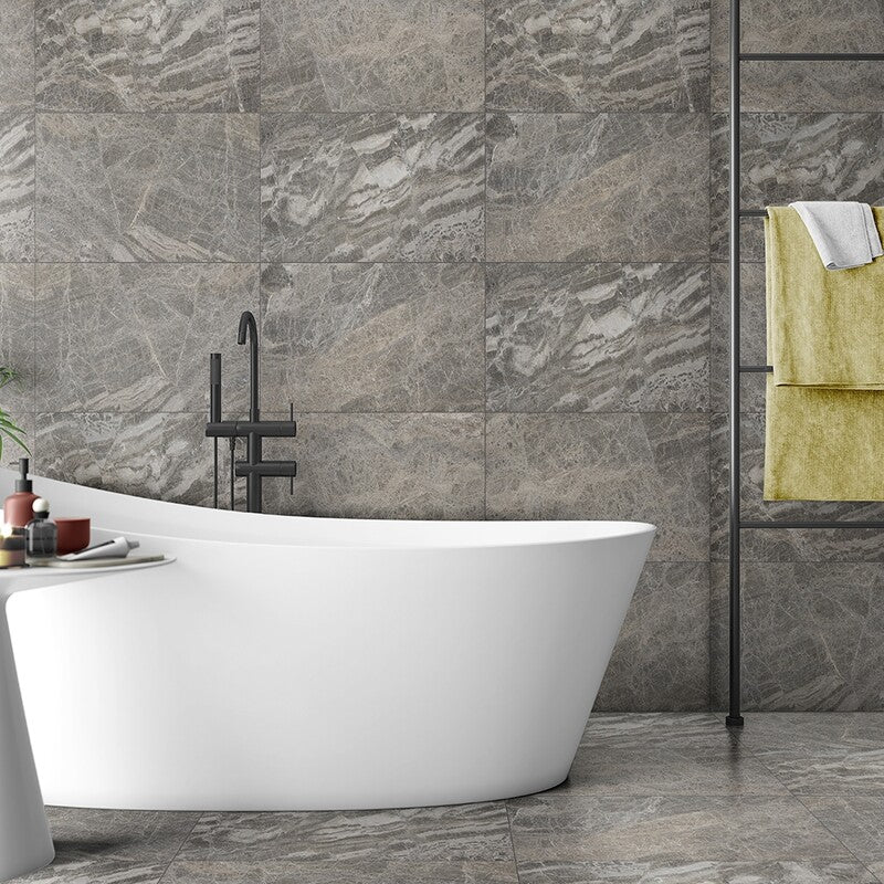 Selection of brown marble tiles in various shades from light creamy to deep espresso, showcasing natural elegance and richness ideal for luxurious interior design.
