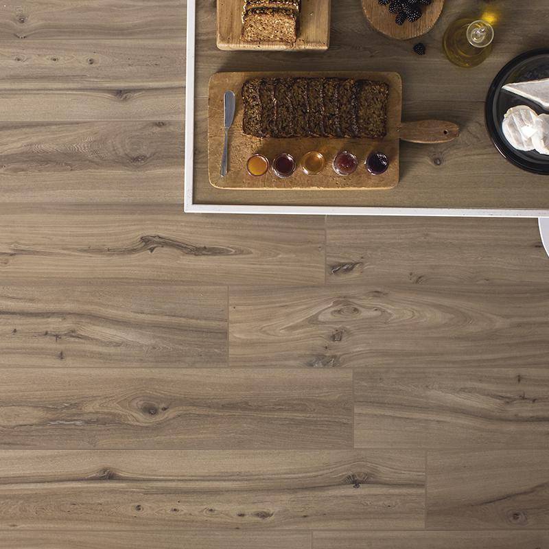 Elm wood-look porcelain tile flooring from Surface Group displaying natural wooden texture and color variations in an interior setting.