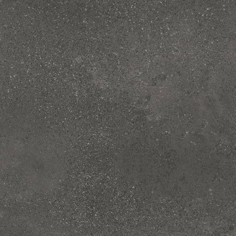 A close-up of a porcelain tile with a textured surface, showcasing shades of dark gray, and speckled with lighter gray and minute black particles throughout, resembling a concrete-like appearance.