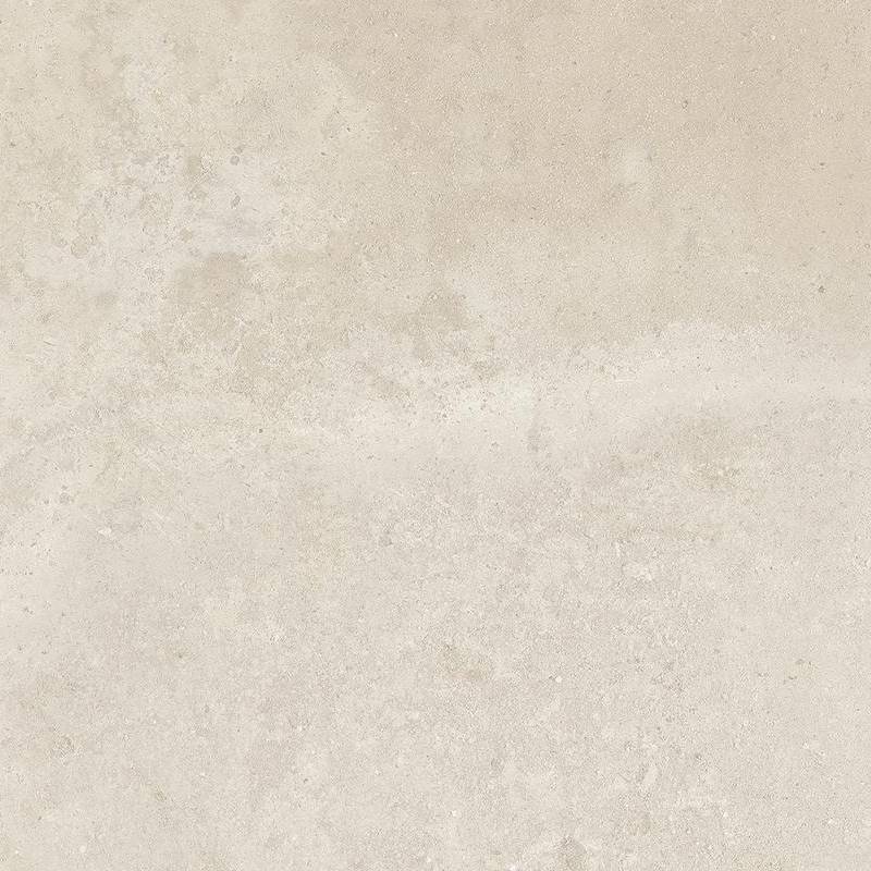 A close-up of a porcelain tile with a textured, slightly mottled beige surface that mimics the look of natural stone. The tile has subtle variations in hue, with light tan and pale cream areas that resemble weathering or an antique patina. |
