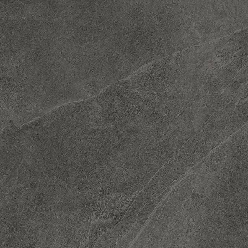 Close-up view of a textured porcelain tile with a slate-like appearance, featuring a combination of dark gray and black hues with subtle white veining.