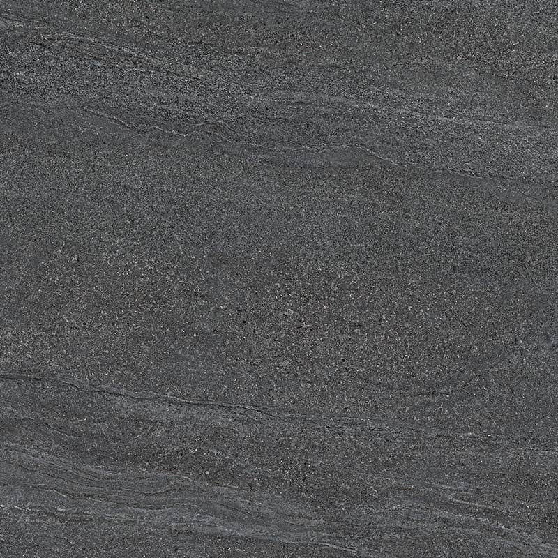 A close-up of an anthracite-colored porcelain tile with subtle linear patterns and a speckled texture that gives a natural stone appearance. |