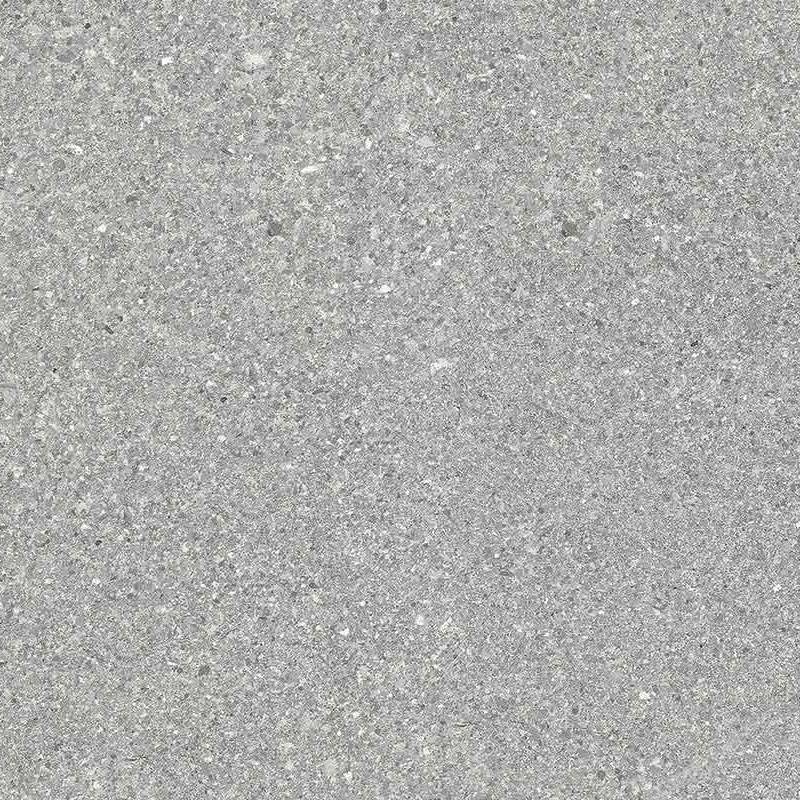 A close-up view of a fine grain grey porcelain tile with subtle speckles and a matte finish, representing a sleek and modern appearance.
