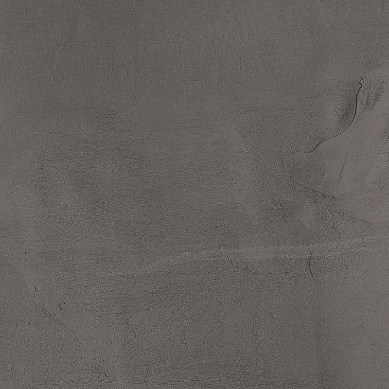 A close-up view of a textured porcelain tile with a dark gray, almost slate color and subtle lighter gray streaks giving it a natural stone appearance. |