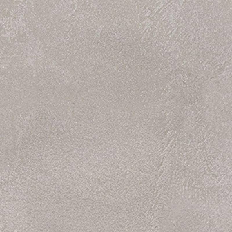 A close-up of a porcelain tile with a subtle texture, displaying a muted shade of light gray with the faintest hint of speckles and a gentle sheen.
