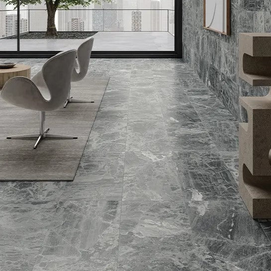 Selection of gray marble tiles in various shades and patterns, showcasing natural elegance and modern sophistication for interior design.