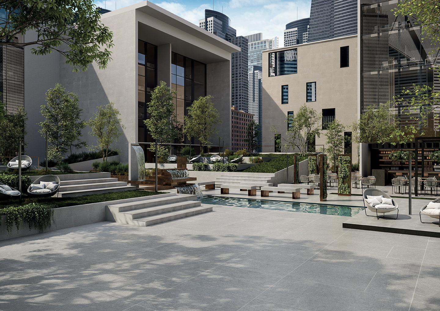 Limestone porcelain tile collection by Surface Group showcased in a modern outdoor patio setting with cityscape background.