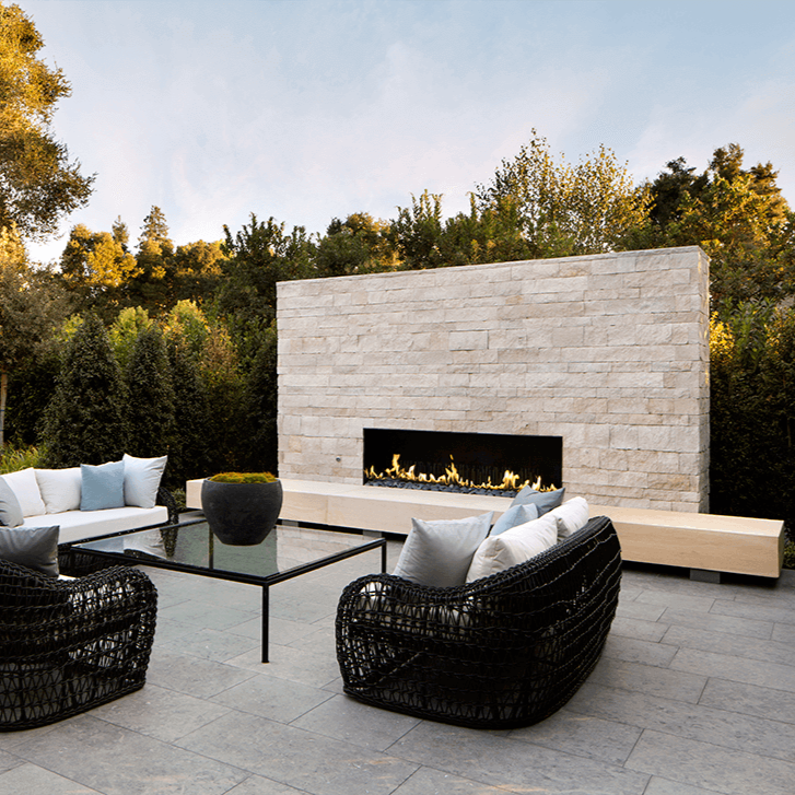 Natural and textured Limestone Paving Tiles in soft earthy tones on outside patio floor, ideal for adding a touch of timeless elegance to indoor and outdoor spaces.