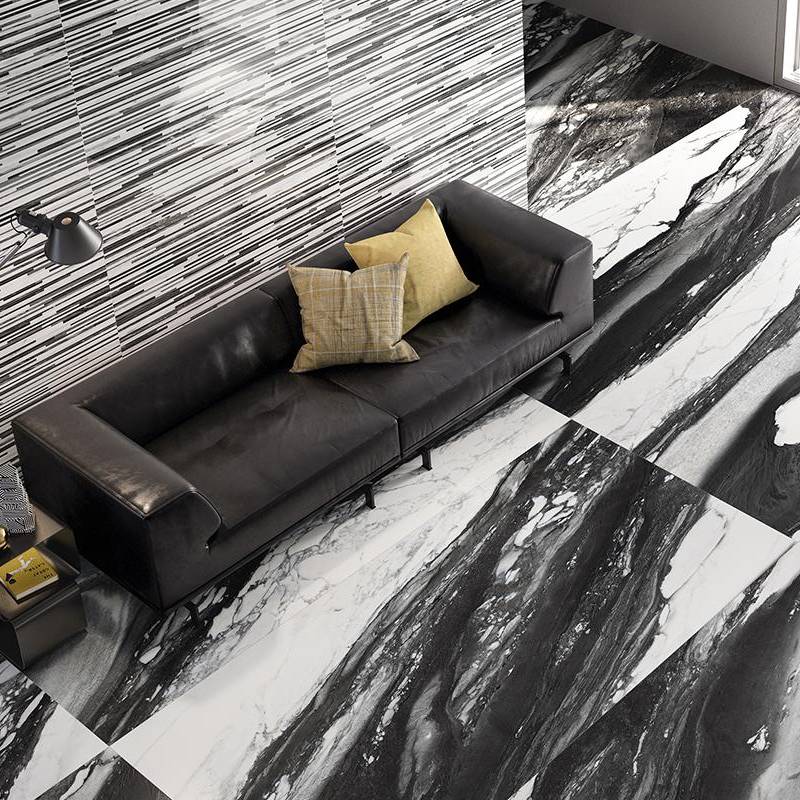 Elegant living room interior with black marble-looking porcelain tile flooring and wall accents.