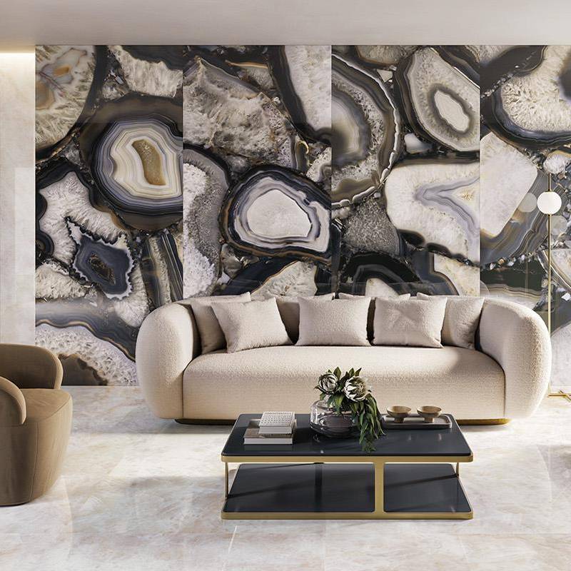 Luxurious living room with quartz crystal stone-look porcelain tile wall, modern beige sofa and contemporary coffee table.
