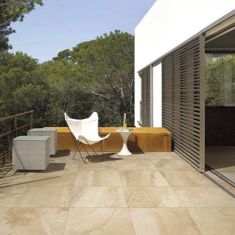 Quartzite stone-look porcelain tile on outdoor patio with modern furniture