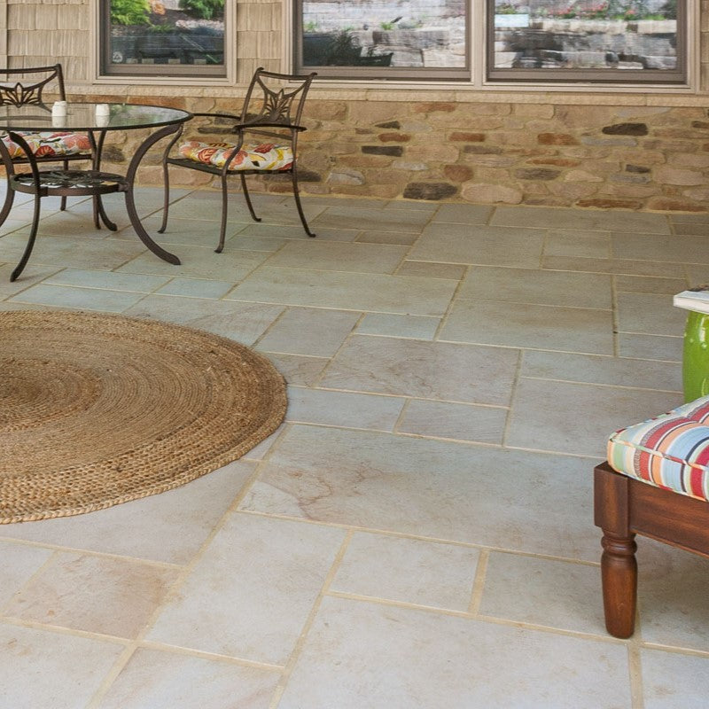 Versatile Sandstone Paving Tile Collection with flagstones, steps, wall and column caps, and stepping stones, showcasing rich textures and warm hues for creating harmonious indoor and outdoor spaces.