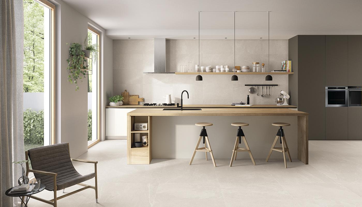 Modern kitchen interior with Emilceramica Nordika Italian porcelain tile flooring and matching backsplash, featuring wooden countertop island and minimalist cabinetry