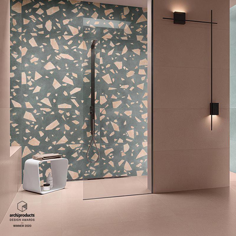 Modern terrazzo style porcelain tile in a bathroom setting with minimalist fixtures and neutral tones.