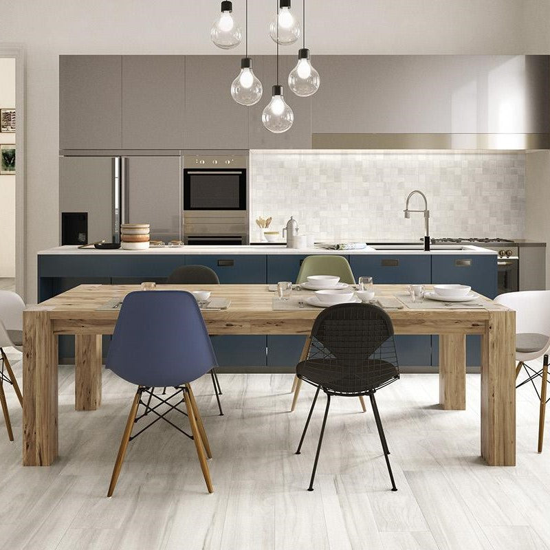 Contemporary kitchen with blue cabinets and toulipier wood-look porcelain tile flooring