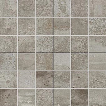 Handcrafted aluminum-look porcelain mosaic with a weathered, oxidized finish and rugged industrial charm. Matte, hammered texture in cool gray tones.