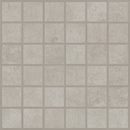 Handcrafted concrete-look mosaic tiles in soft pebble gray with delicate reliefs and a refined matte finish.