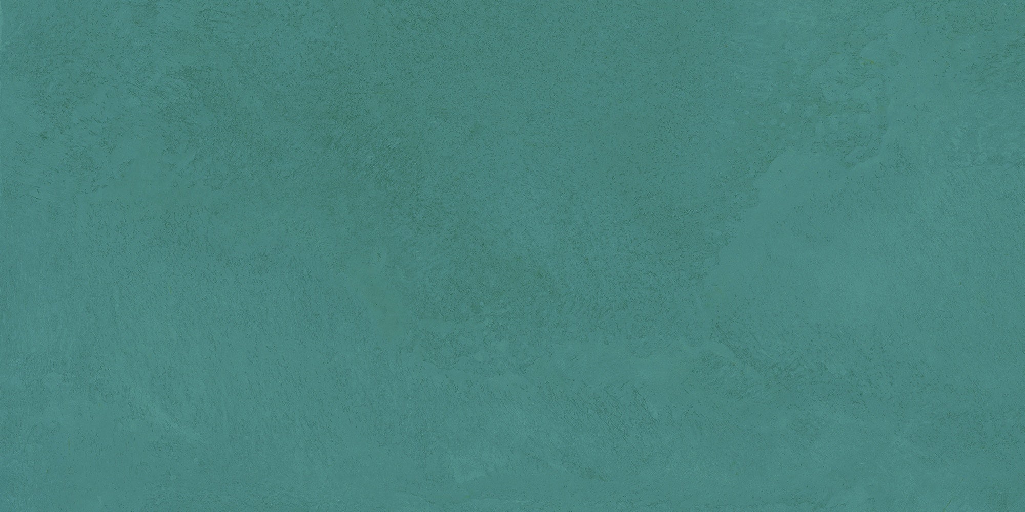 Smooth matte denim-green porcelain tile with raw-earth texture, evoking serene harmony and timeless organic elegance.