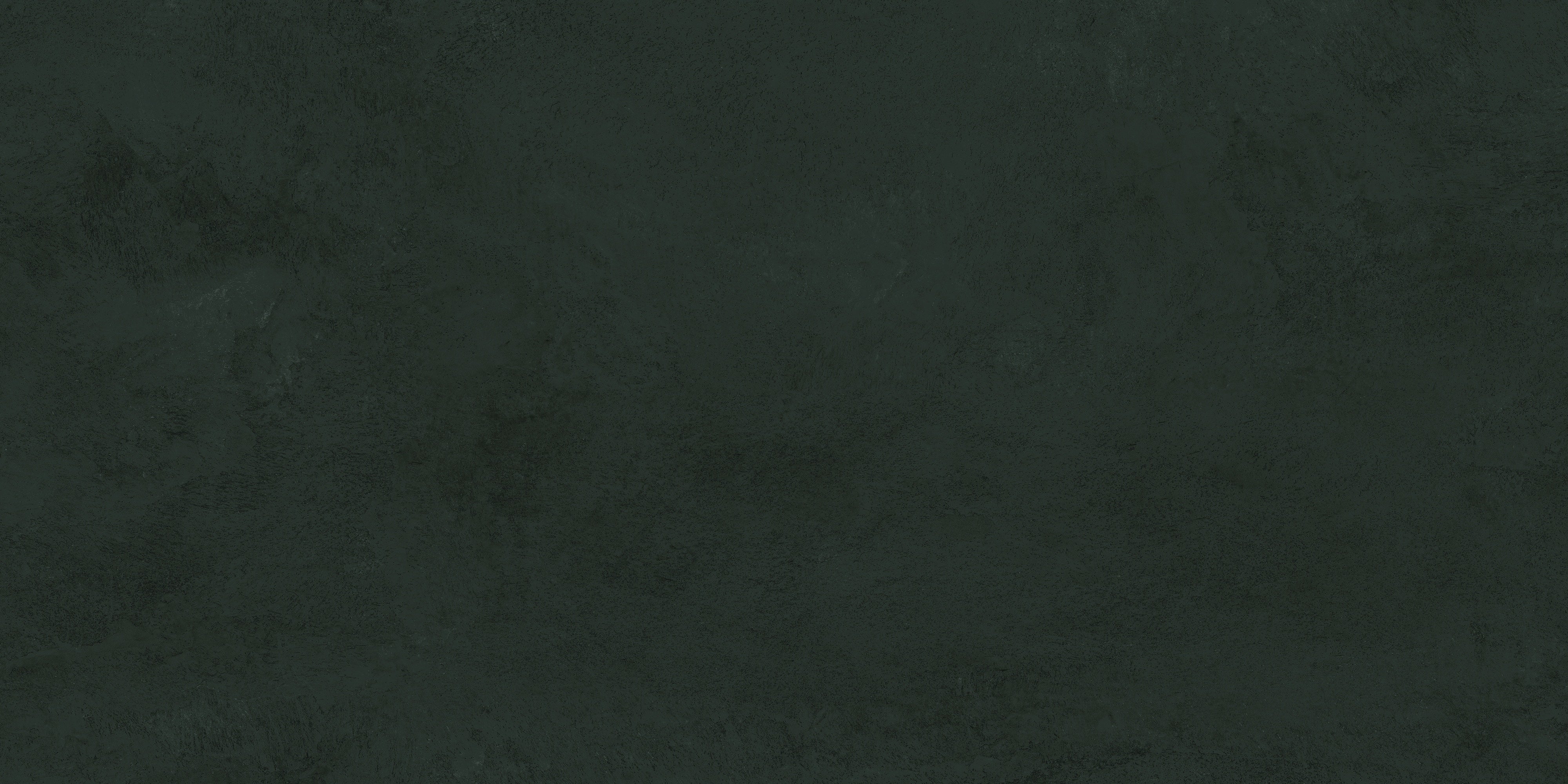 Black porcelain tile with a smooth matte finish, evoking raw earth and timeless serenity in contemporary minimalist spaces.